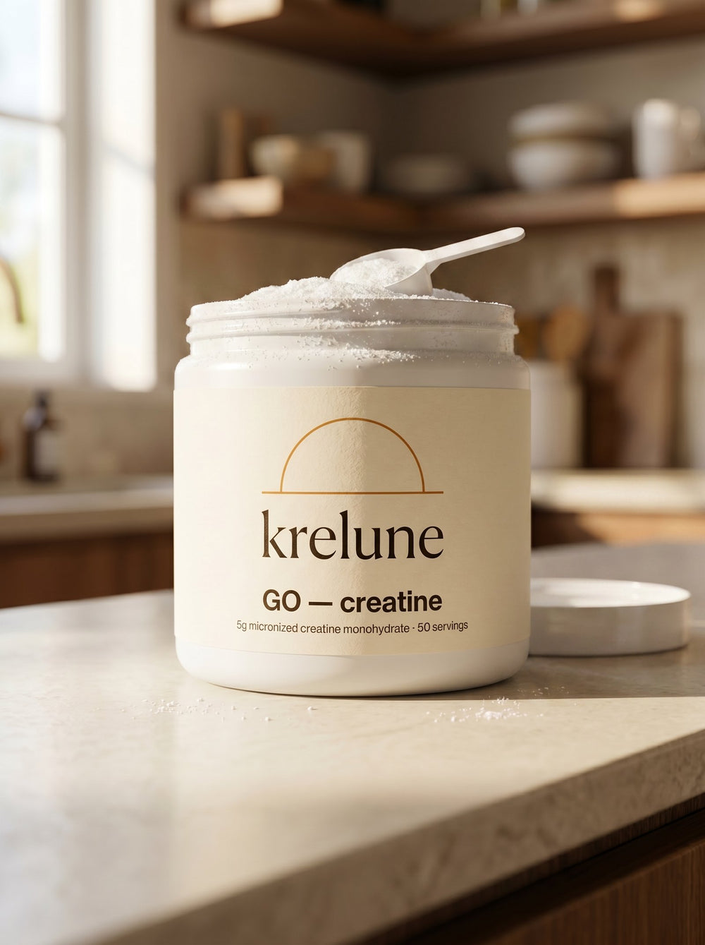 Open Krelune GO Creatine tub showing fine white crystalline powder with measuring scoop