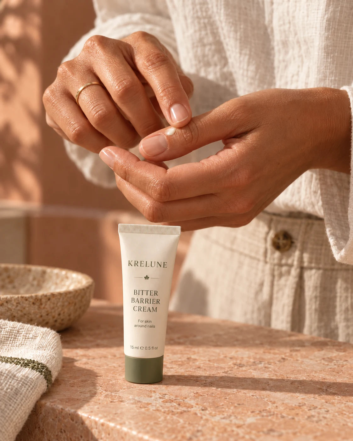 A small daily cream ritual for the skin around a fingernail