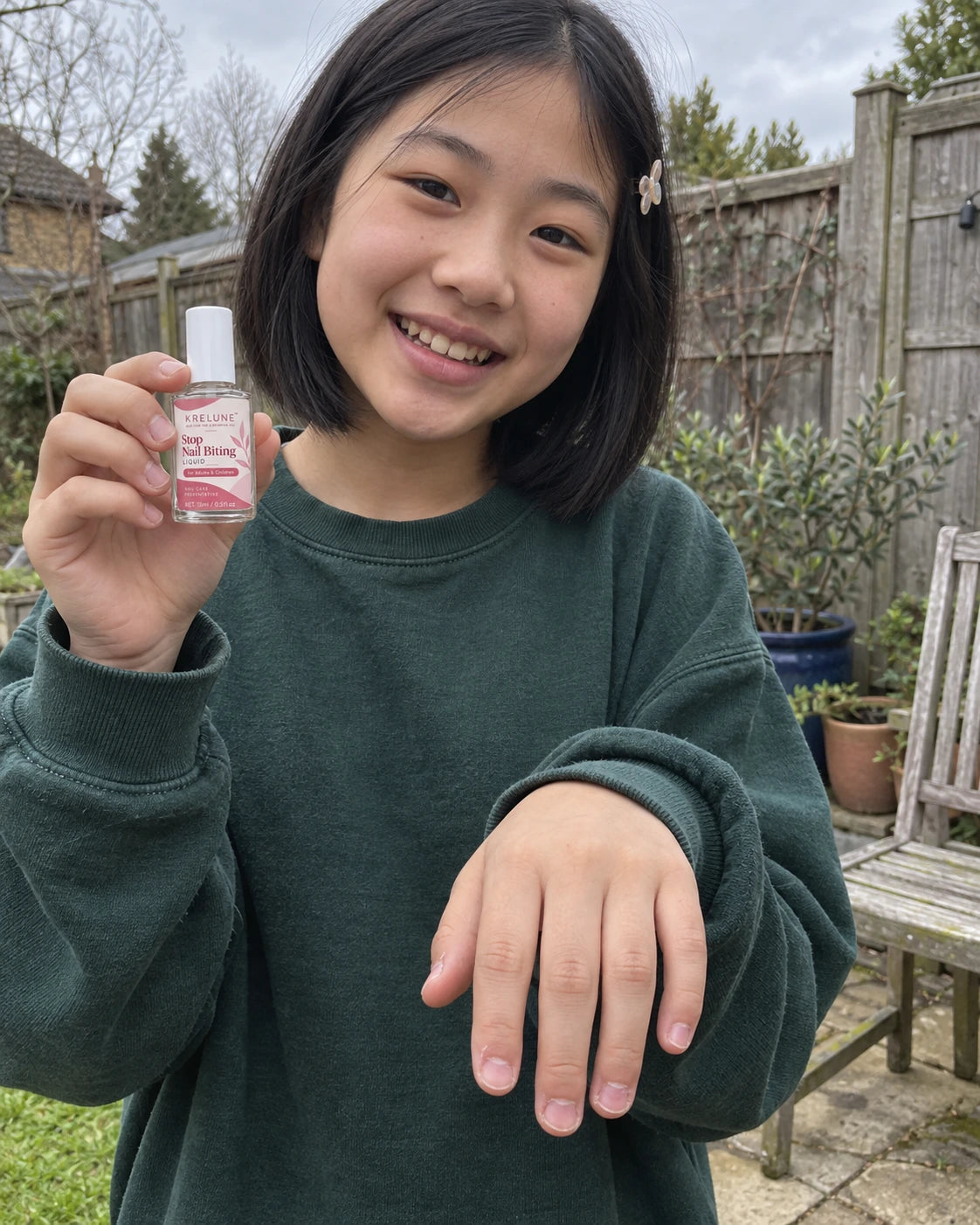 Illustrative child portrait with a closed Krelune polish bottle and short uneven nails